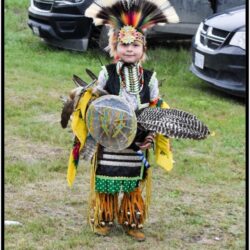 little boy in traditional ceremony clothing