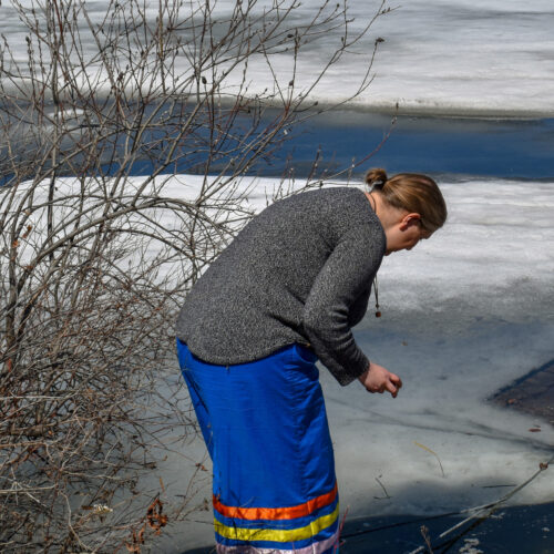 women with blue traditional skirt