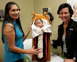two women with a baby